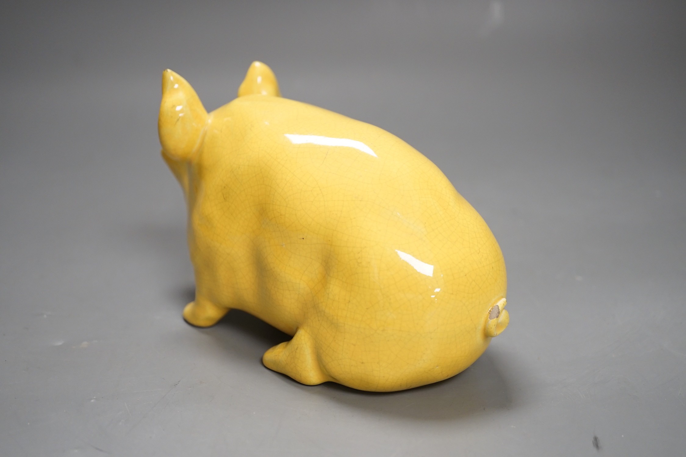 A Wemyss ware yellow glazed pig, 17cms long